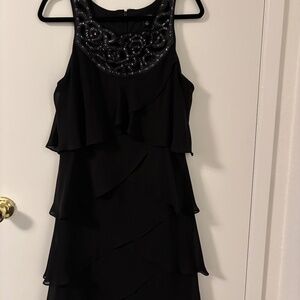 SL Fashions Black Tiered Cocktail Dress with Embellished Neckline